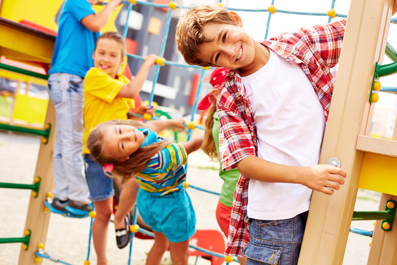 Image of joyful friends having fun on playground outdoors